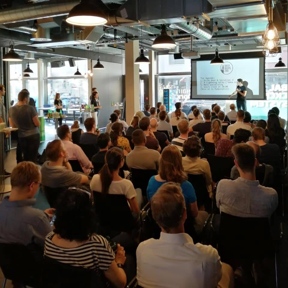 People listening to a speaker